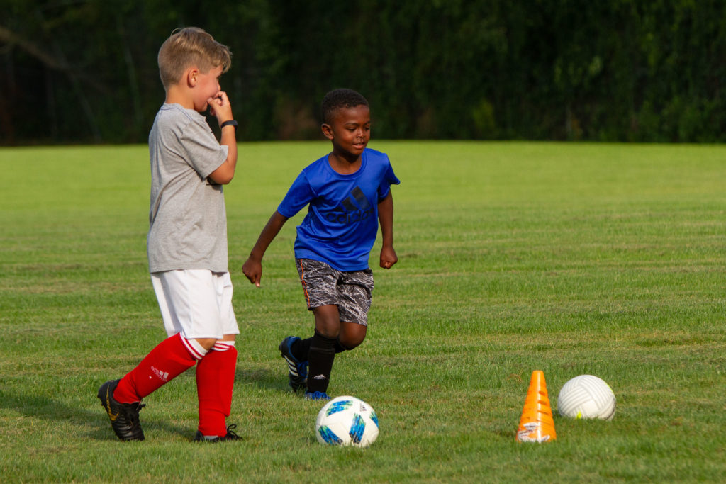 players kicking the ball