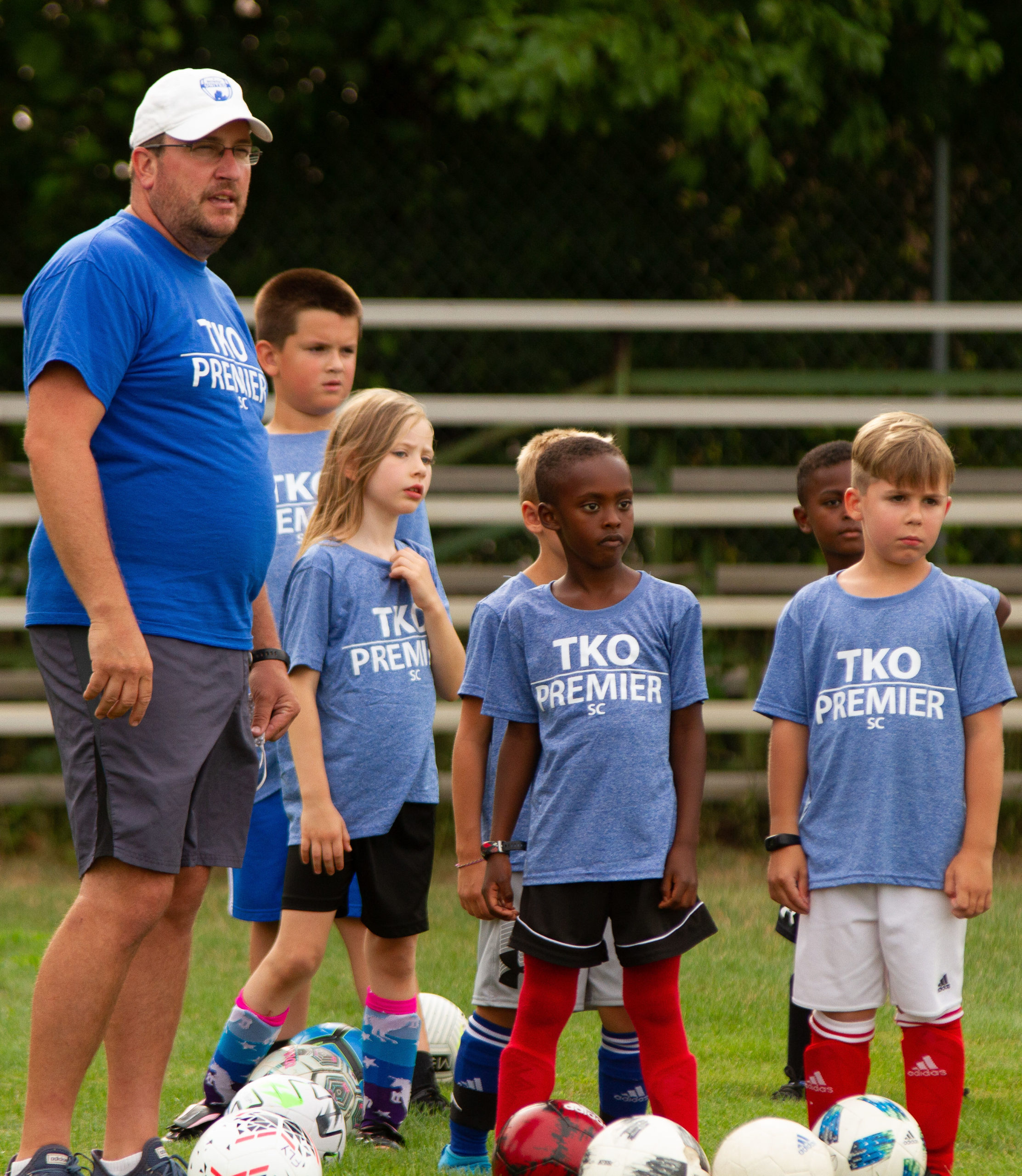 players watching a training drill